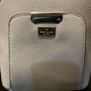 Kate Spade , small Grey in color , back pack purse.